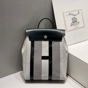 Hermes H084076CKAD A Dos Zip Retourne Herbag Backpack Toile Vache Hunter Ebene H60070 - Default Title - View 1