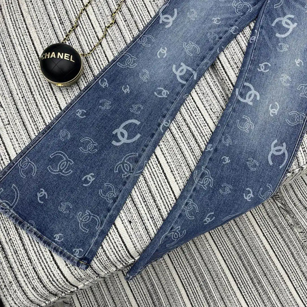 Chanel Women Double C logo print flared denim trousers Jeans C58813