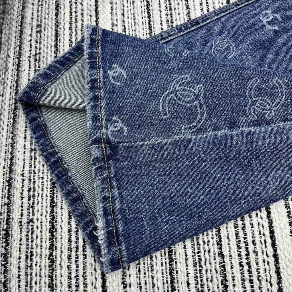 Chanel Women Double C logo print flared denim trousers Jeans C58813