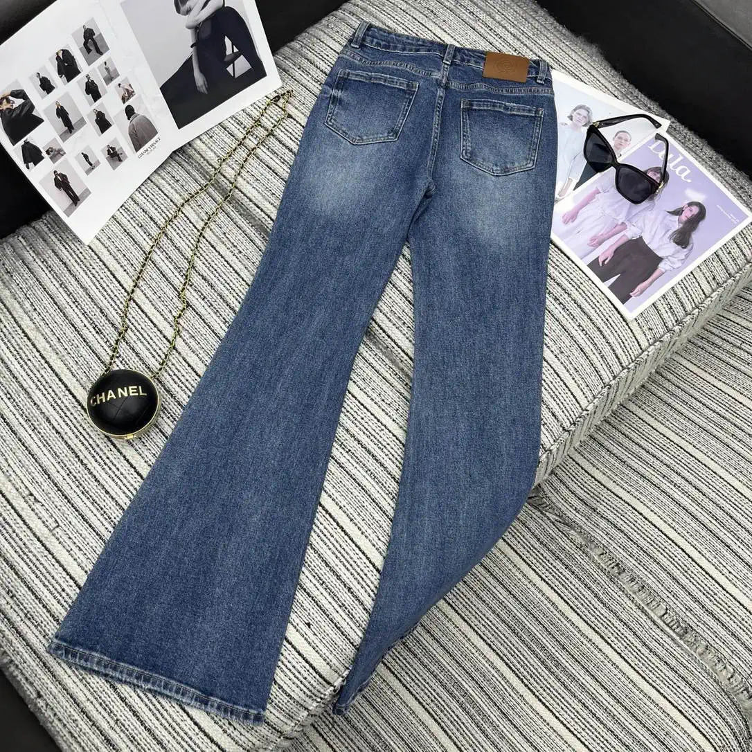 Chanel Women Double C logo print flared denim trousers Jeans C58813