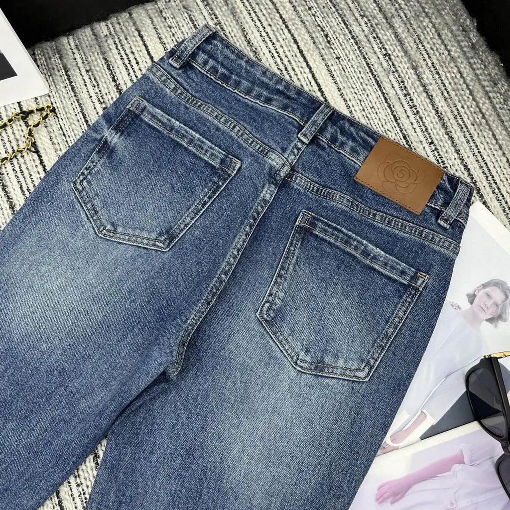 Chanel Women Double C logo print flared denim trousers Jeans C58813