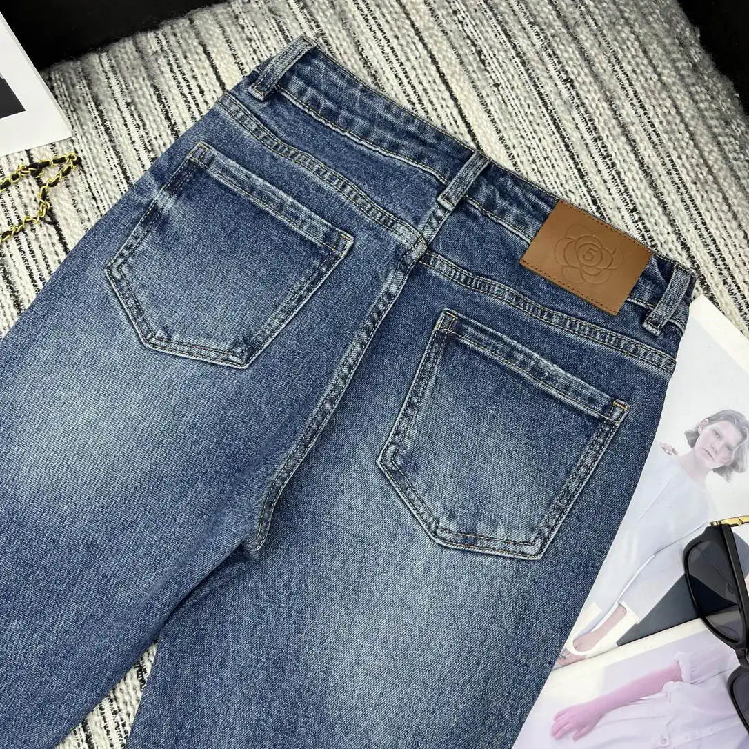 Chanel Women Double C logo print flared denim trousers Jeans C58813