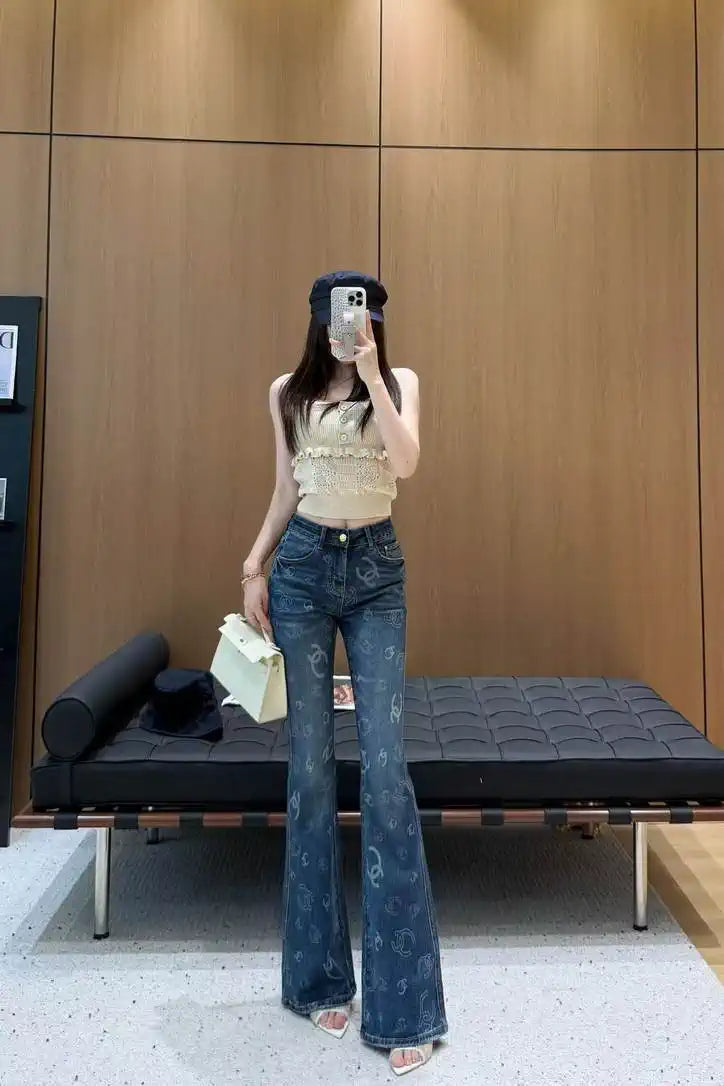 Chanel Women Double C logo print flared denim trousers Jeans C58813