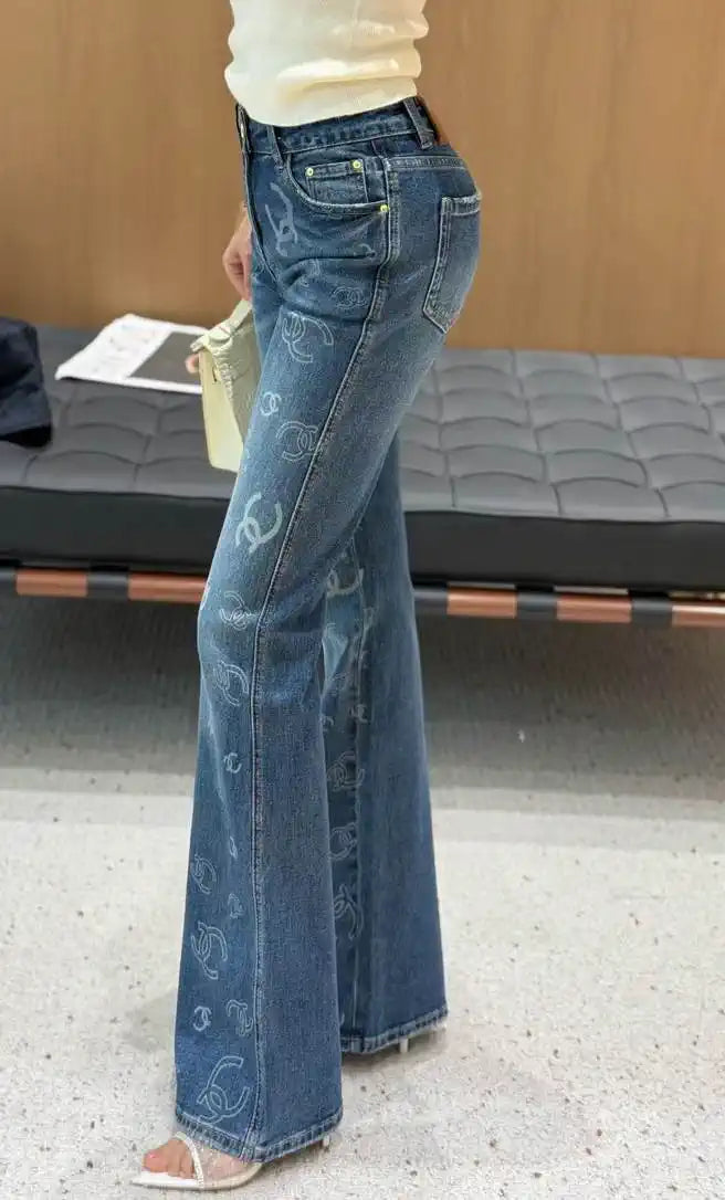 Chanel Women Double C logo print flared denim trousers Jeans C58813