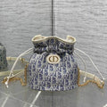 Dior S2374 30 Montaigne Mini Bucket Bag with Drawstring Blue Dior Oblique Chambray with Raffia Effect and Light Biscuit Smooth Calfskin