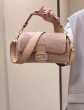 Fendi 8BR600 Baguette Medium Re-Edition bag in Pink lam¨¦ sheepskin