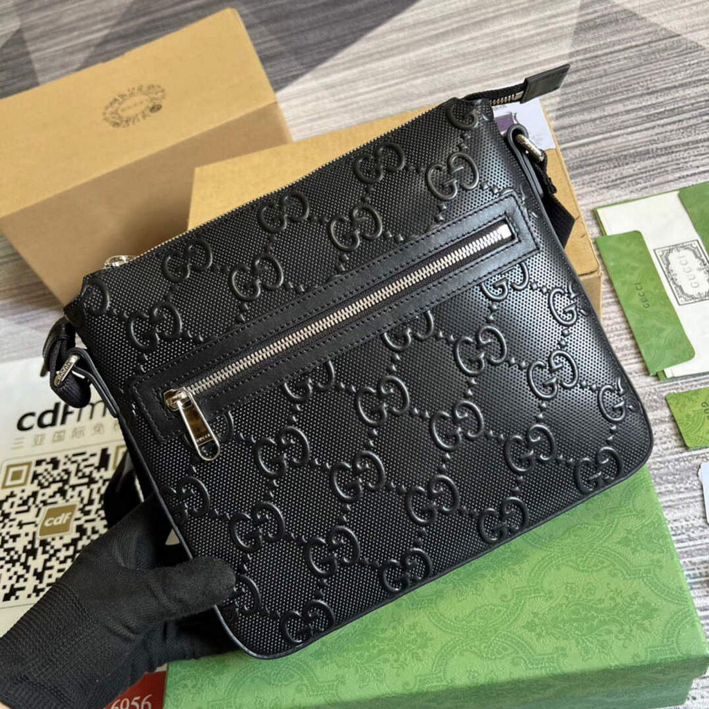 Gucci 406410 GG embossed small messenger bag Black