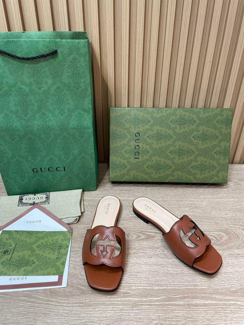 Gucci 694451 Women's Interlocking G cut-out slide sandal G66756
