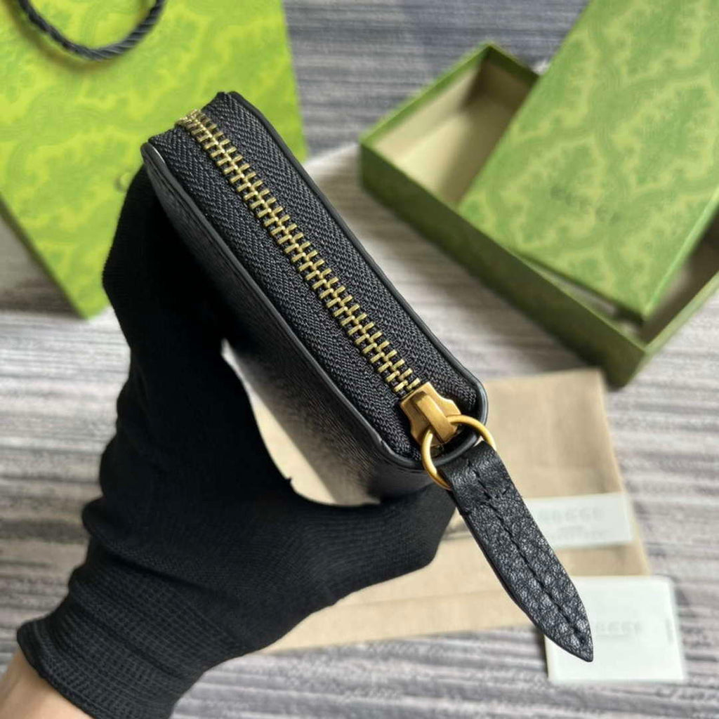 Gucci 750458 Zip wallet with Interlocking G python bow Black