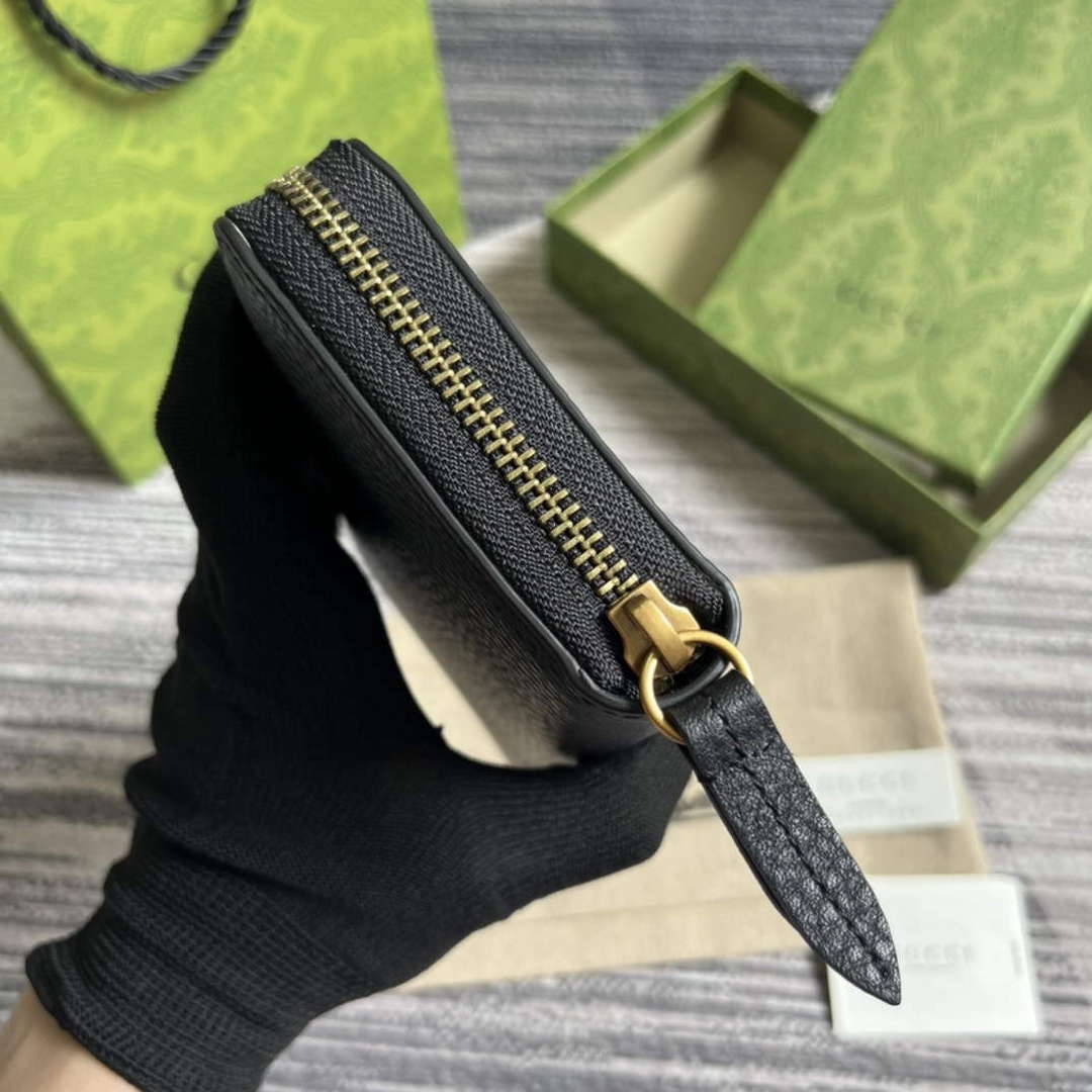 Gucci 750458 Zip wallet with Interlocking G python bow Black