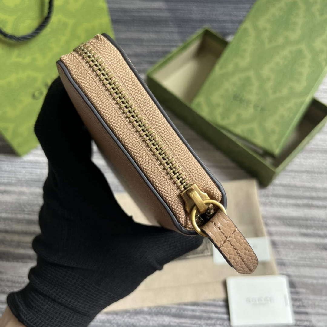 Gucci 750458 Zip wallet with Interlocking G python bow Rose beige
