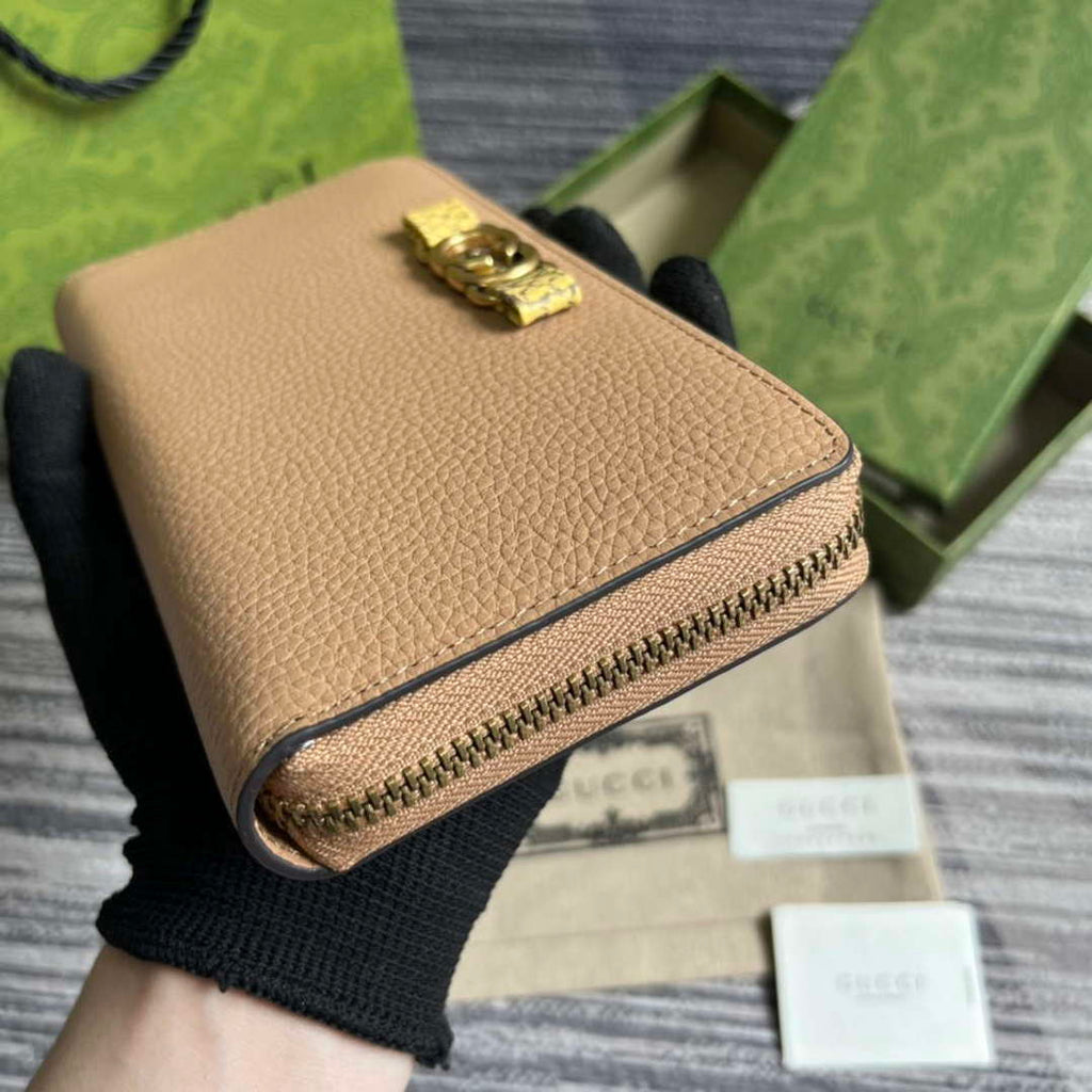 Gucci 750458 Zip wallet with Interlocking G python bow Rose beige