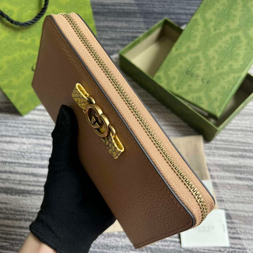 Gucci 750458 Zip wallet with Interlocking G python bow Rose beige