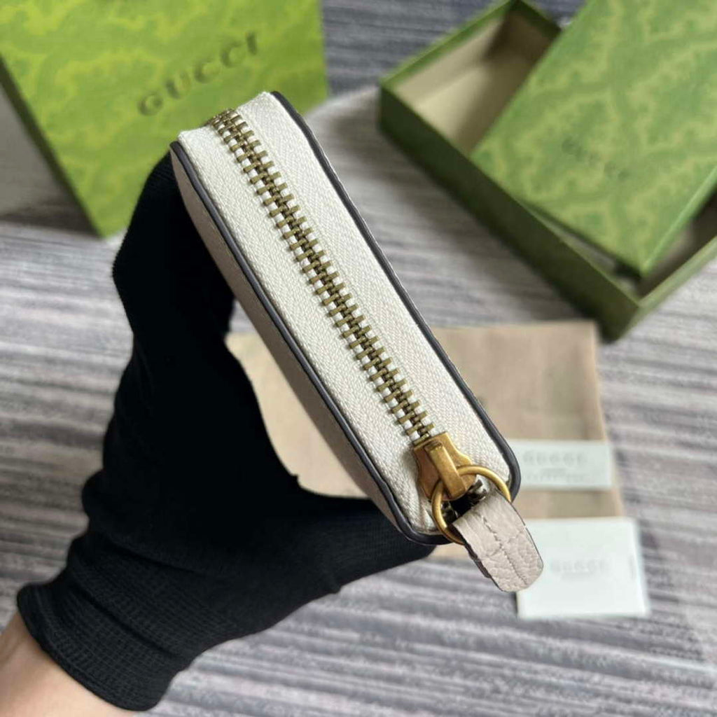 Gucci 750458 Zip wallet with Interlocking G python bow White