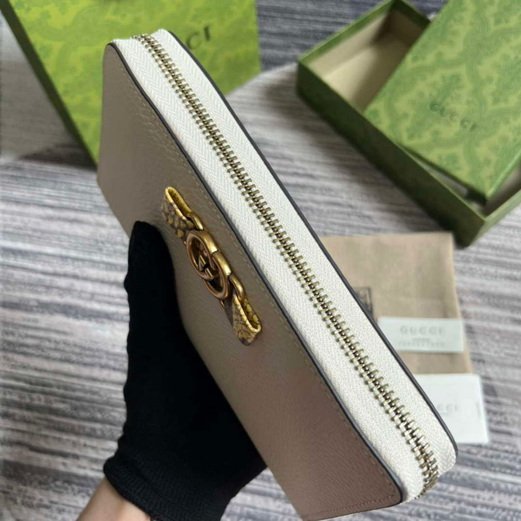 Gucci 750458 Zip wallet with Interlocking G python bow White