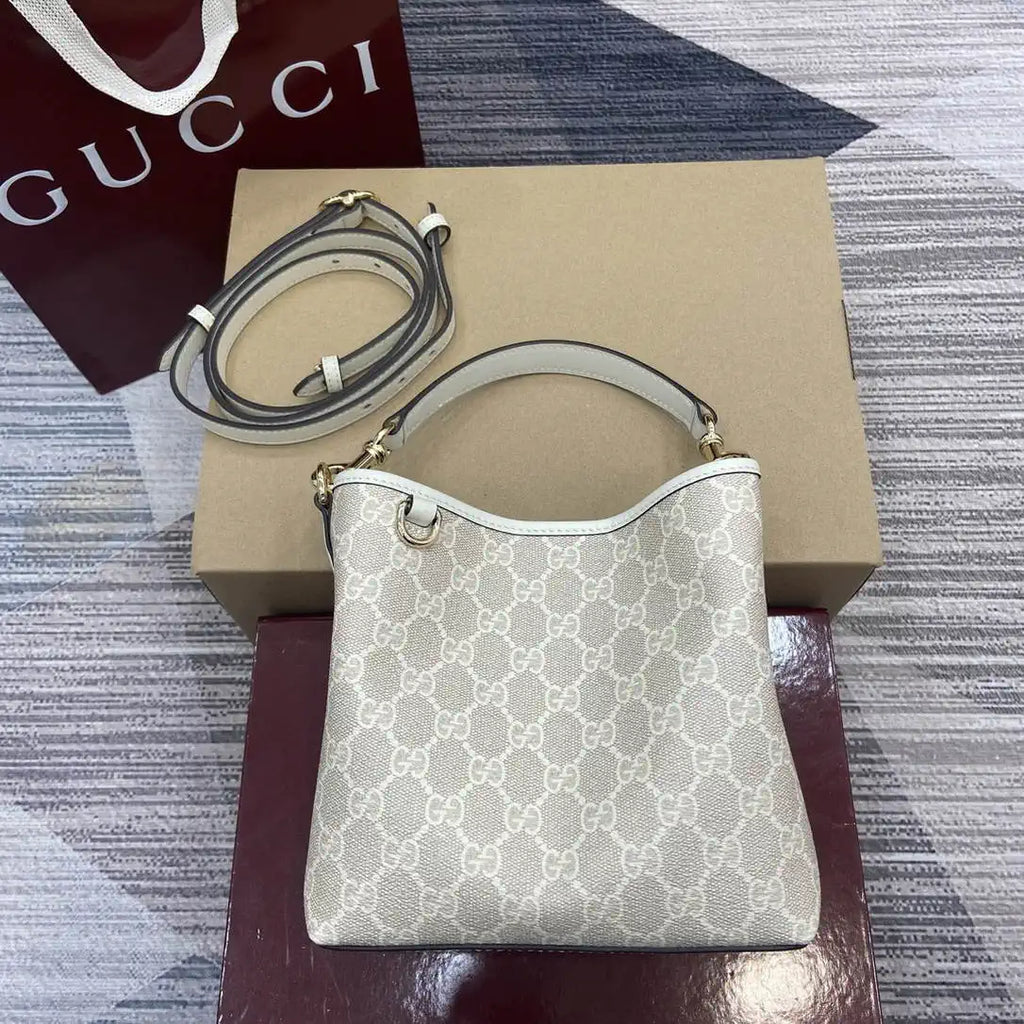 Gucci 815118 GG Emblem small bucket bag beige and white fabric