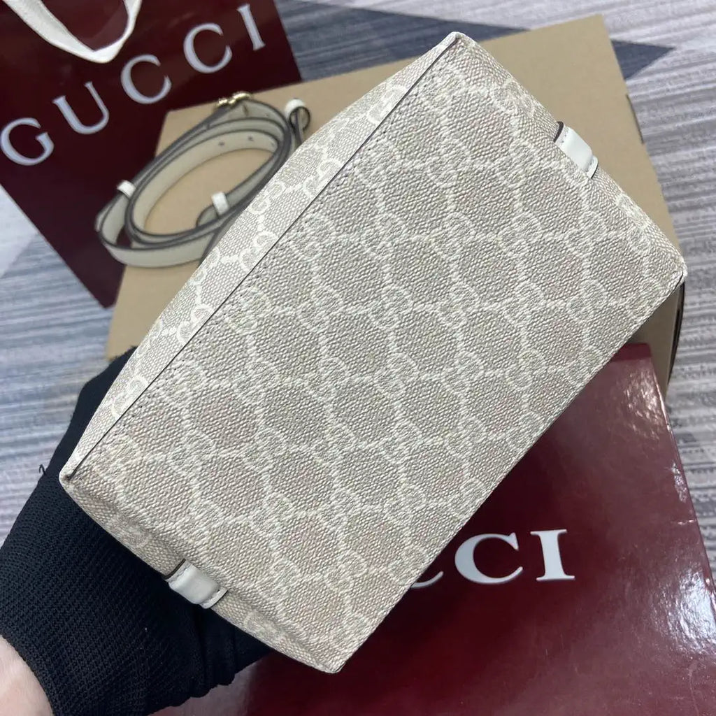 Gucci 815118 GG Emblem small bucket bag beige and white fabric