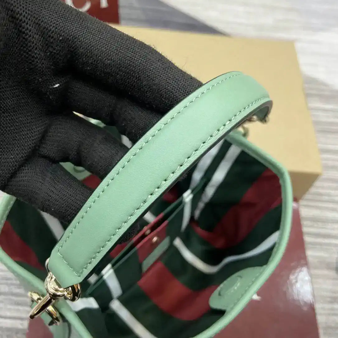 Gucci 815118 GG Emblem small bucket bag Green fabric