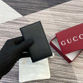 Gucci 818953 GG Emblem bi-fold embossed card case Black