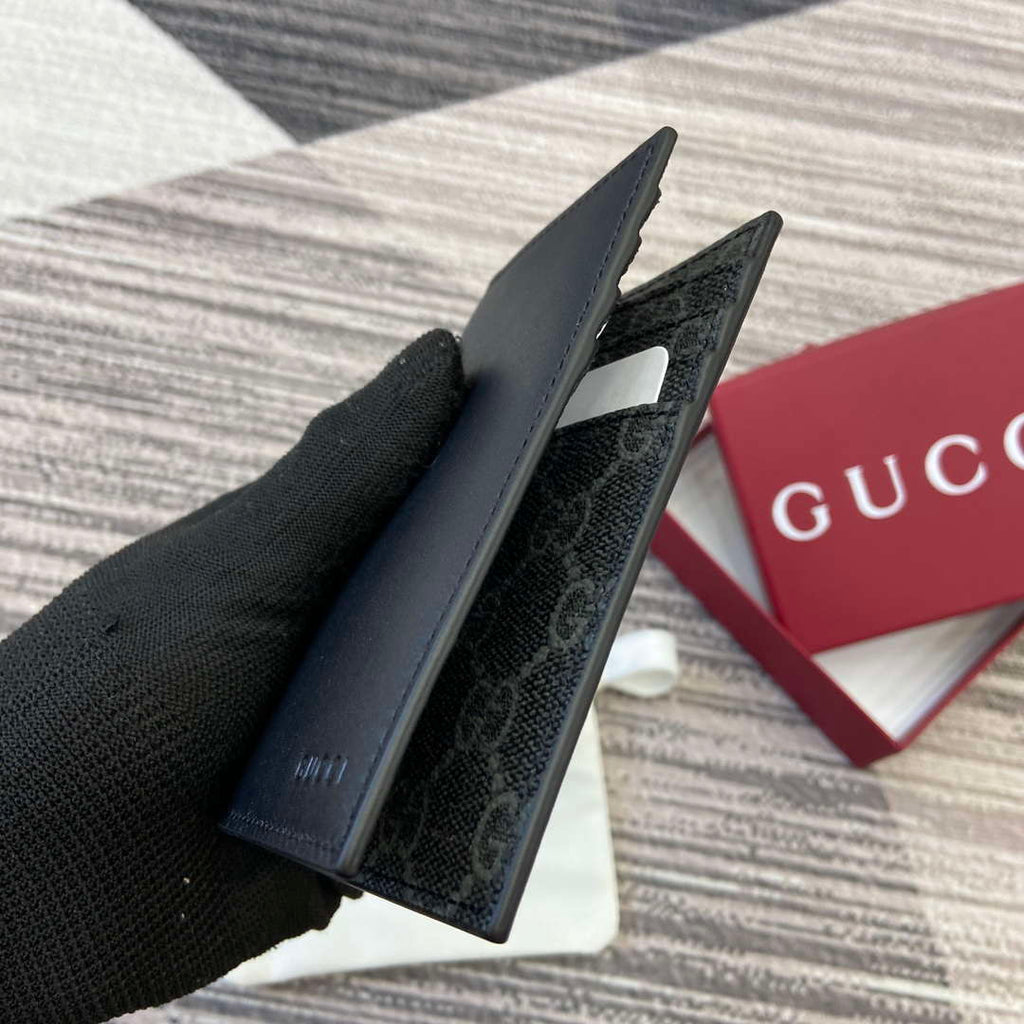 Gucci 818953 GG Emblem bi-fold embossed card case Black