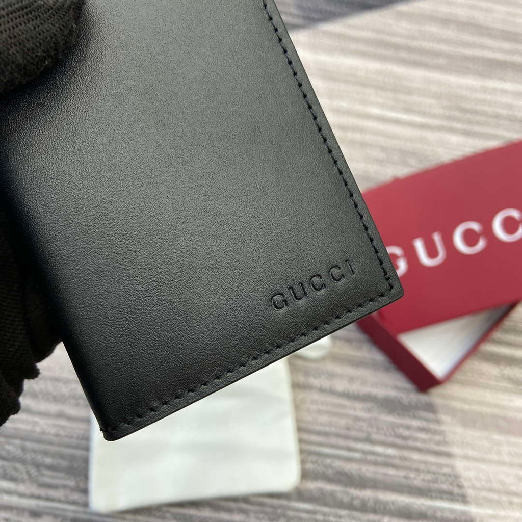 Gucci 818953 GG Emblem bi-fold embossed card case Black