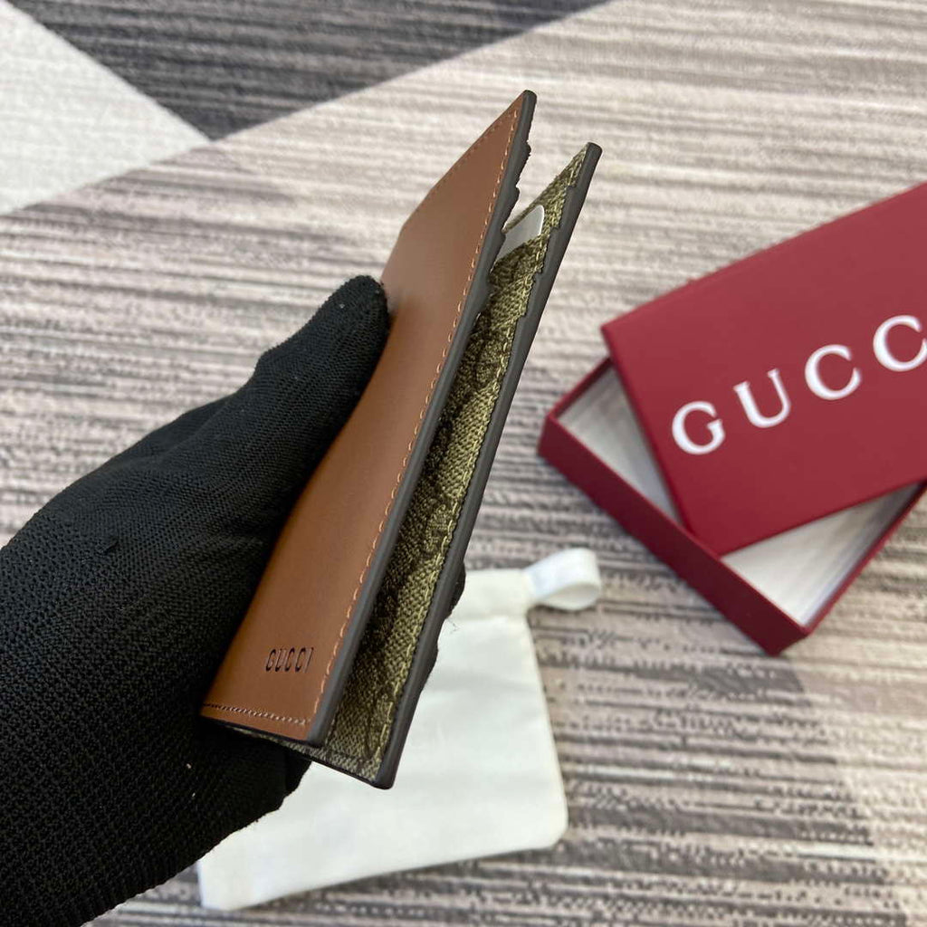 Gucci 818953 GG Emblem bi-fold embossed card case Brown