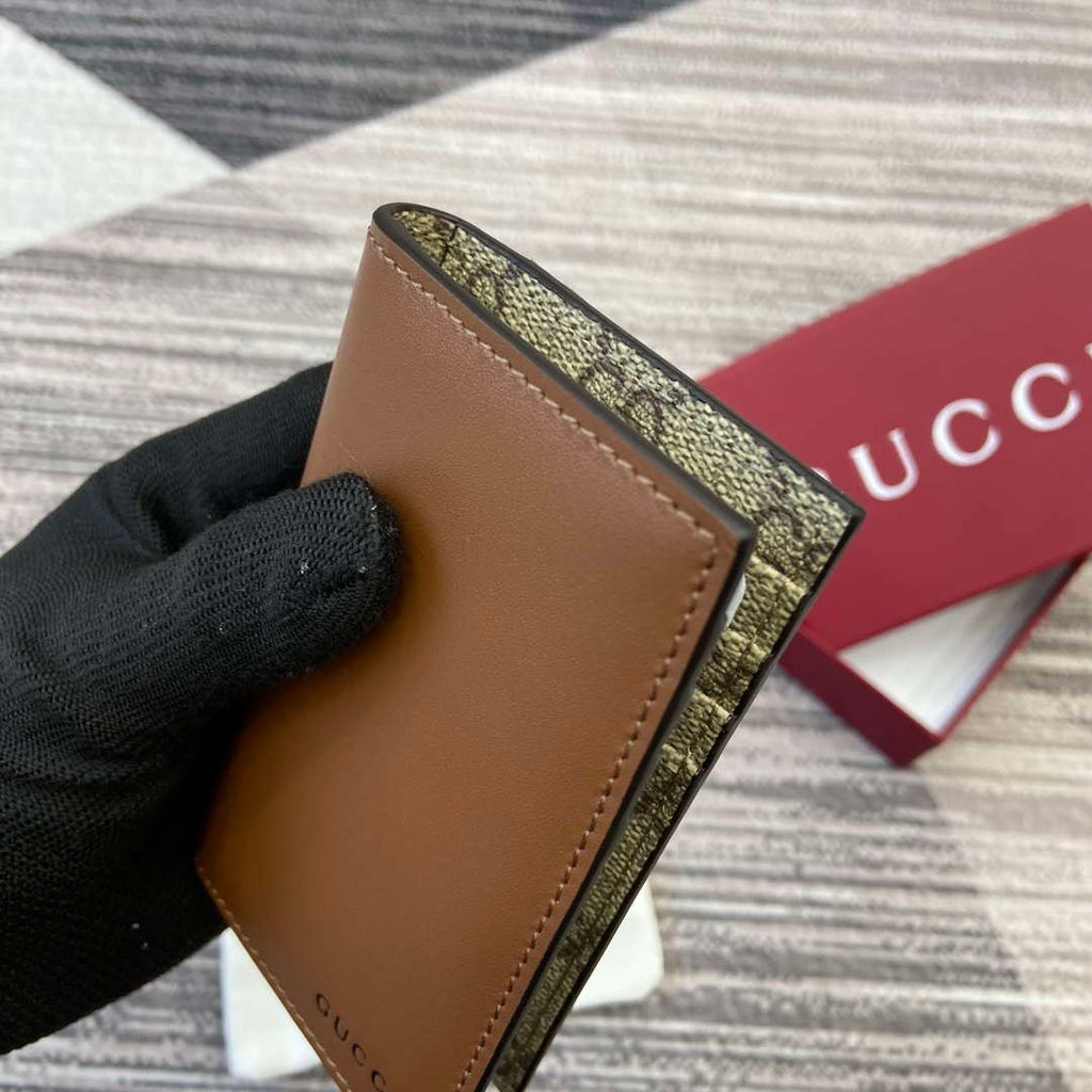 Gucci 818953 GG Emblem bi-fold embossed card case Brown