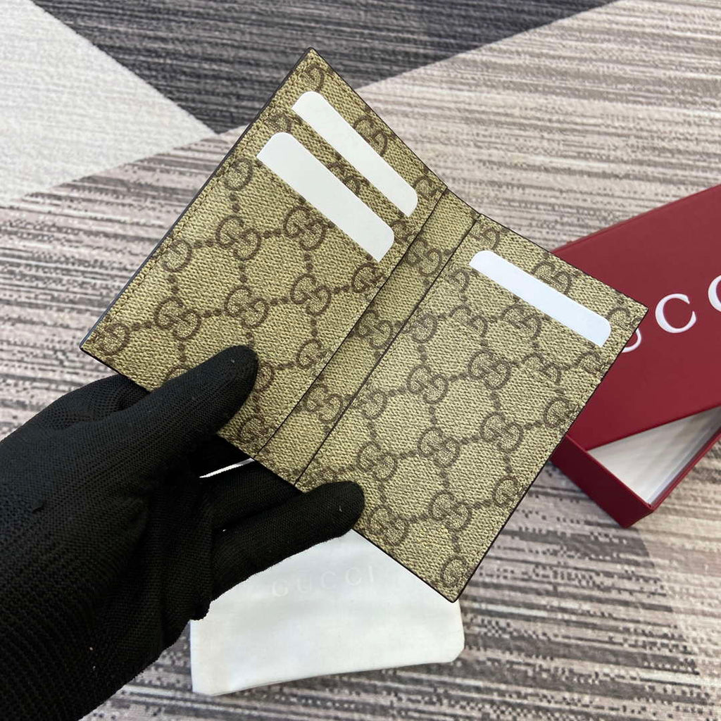 Gucci 818953 GG Emblem bi-fold embossed card case Brown