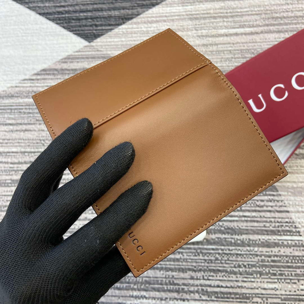 Gucci 818953 GG Emblem bi-fold embossed card case Brown