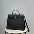 Hermes H082835CKAC Herbag Zip 31 Bag in Black Hunter Leather and Canvas H60028 - Default Title - View 1