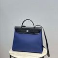 Hermes H082835CKAC Herbag Zip 31 Bag in Black Hunter Leather and Canvas H60029 - Default Title - View 1