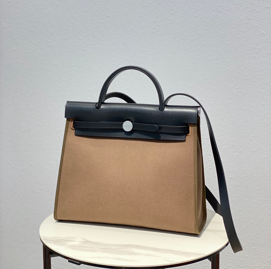 Hermes H082835CKAC Herbag Zip 31 Bag in Black Hunter Leather and Canvas H60031 - Default Title - View 1