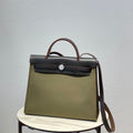 Hermes H082835CKAC Herbag Zip 31 Bag in Black Hunter Leather and Canvas H60032 - Default Title - View 1