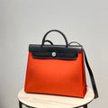 Hermes H082835CKAC Herbag Zip 31 Bag in Black Hunter Leather and Canvas H60033 - Default Title - View 1