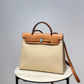 Hermes H082835CKAC Herbag Zip 31 Bag in Black Hunter Leather and Canvas H60038 - Default Title - View 1