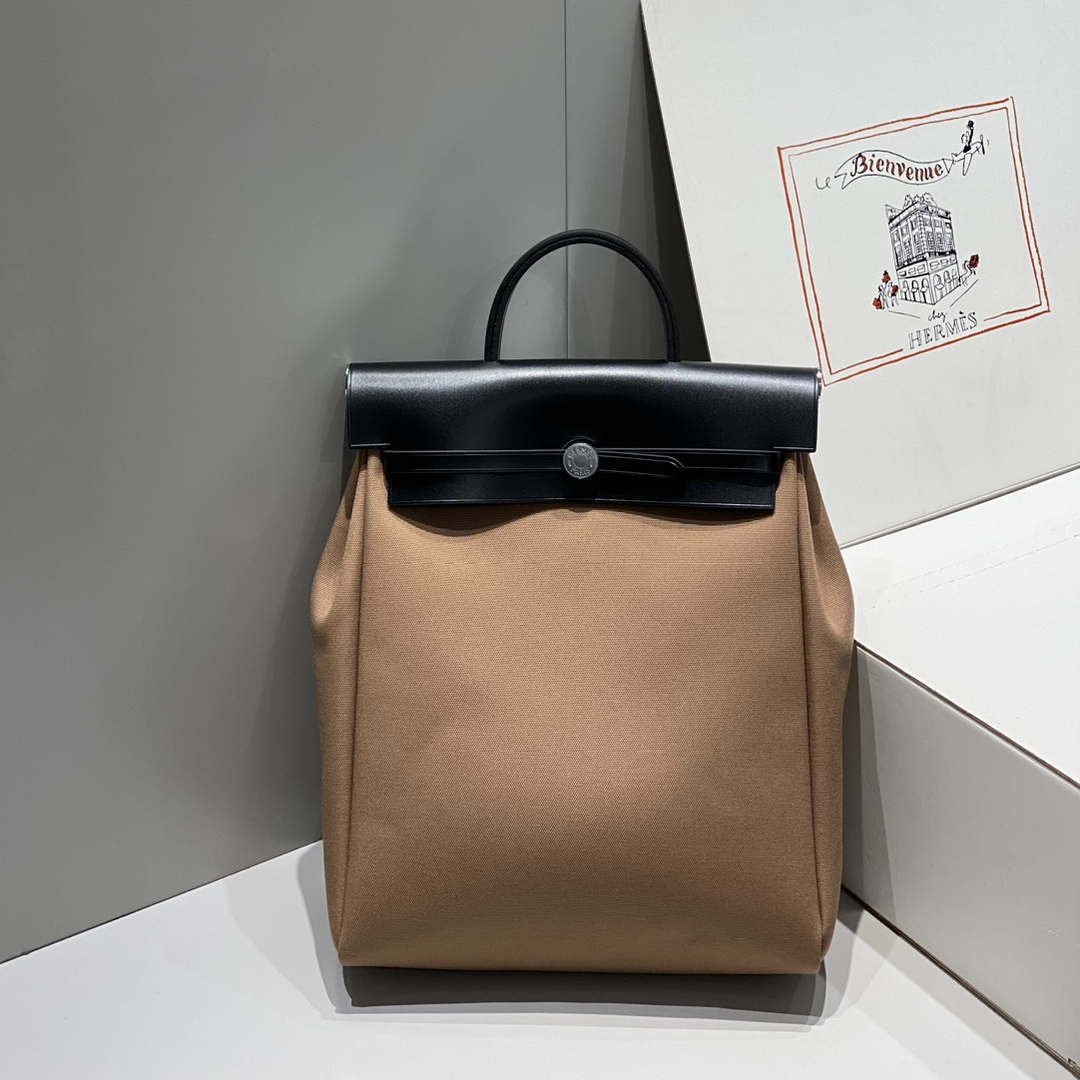 Hermes H084076CKAD A Dos Zip Retourne Herbag Backpack Toile Vache Hunter Ebene H60067 - Default Title - View 1