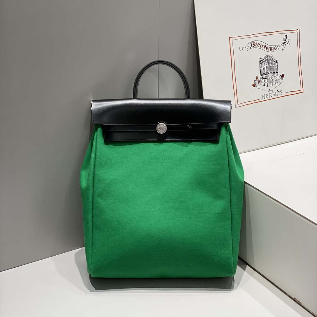 Hermes H084076CKAD A Dos Zip Retourne Herbag Backpack Toile Vache Hunter Ebene H60069 - Default Title - View 1