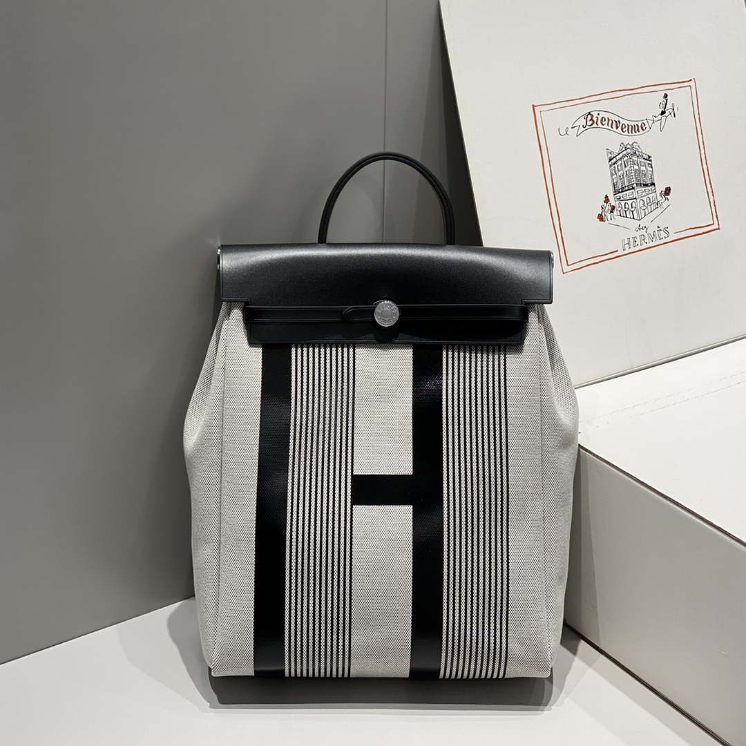 Hermes H084076CKAD A Dos Zip Retourne Herbag Backpack Toile Vache Hunter Ebene H60070 - Default Title - View 1
