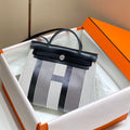 Hermes H084076CKAD Herbag Zip 31 Bag in Black Hunter Leather and Canvas H60047 - Default Title - View 1