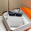 Hermes H084076CKAD Herbag Zip 31 Bag in Black Hunter Leather and Canvas H60048 - Default Title - View 1