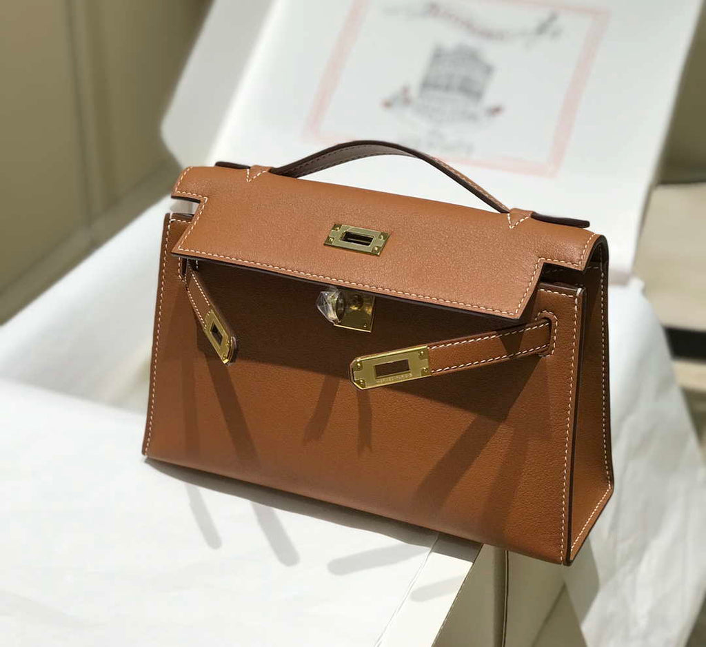 Hermes Kelly Pouchette Swift Leather clutch bag Gold H230265