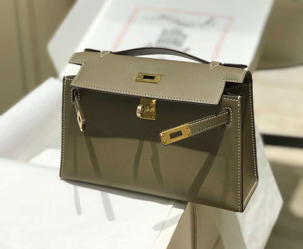 Hermes Kelly Pouchette Swift Leather clutch bag Gold H230274