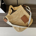 Loewe Slit pochette bag in raffia and calfskin 32824W10