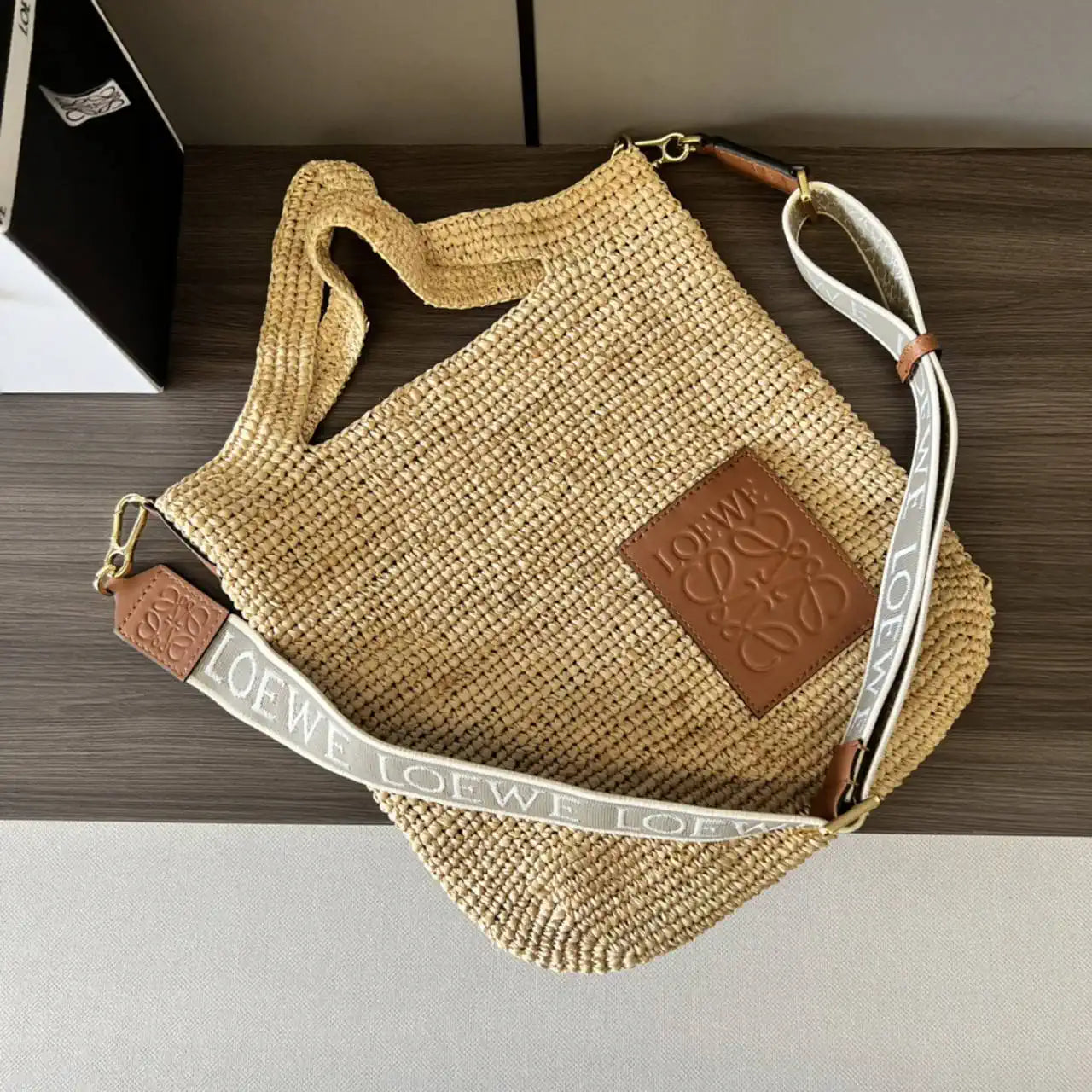 Loewe Slit pochette bag in raffia and calfskin 32824W10