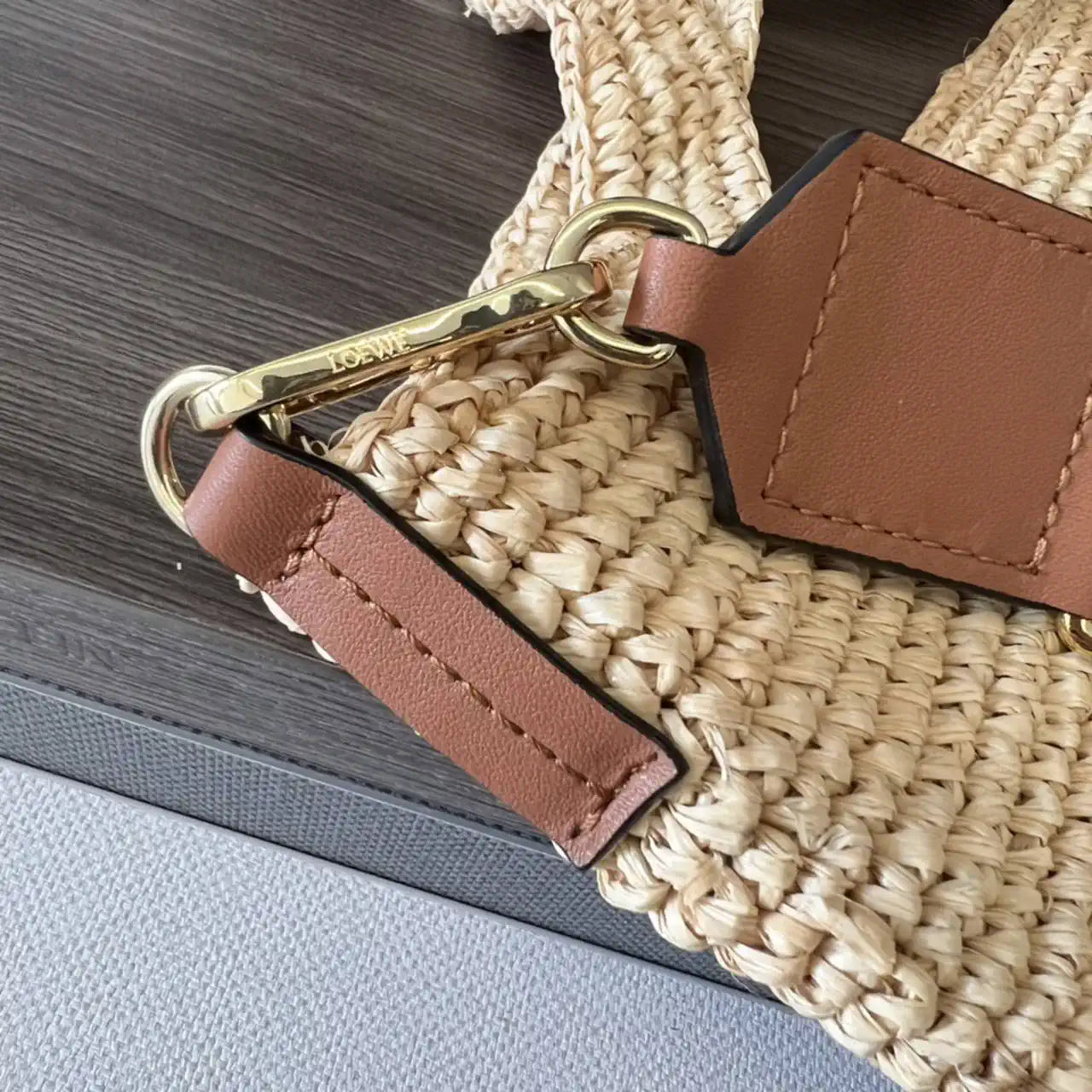 Loewe Slit pochette bag in raffia and calfskin 32824W10