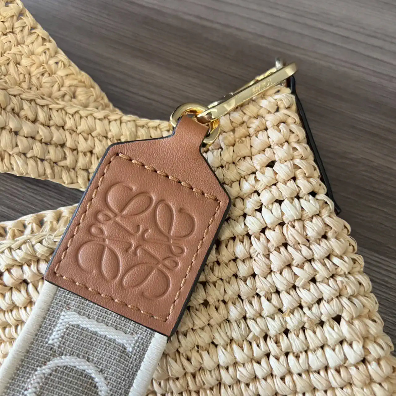 Loewe Slit pochette bag in raffia and calfskin 32824W10