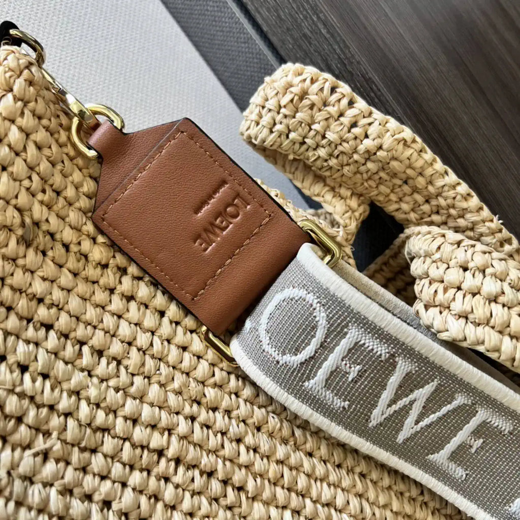 Loewe Slit pochette bag in raffia and calfskin 32824W10