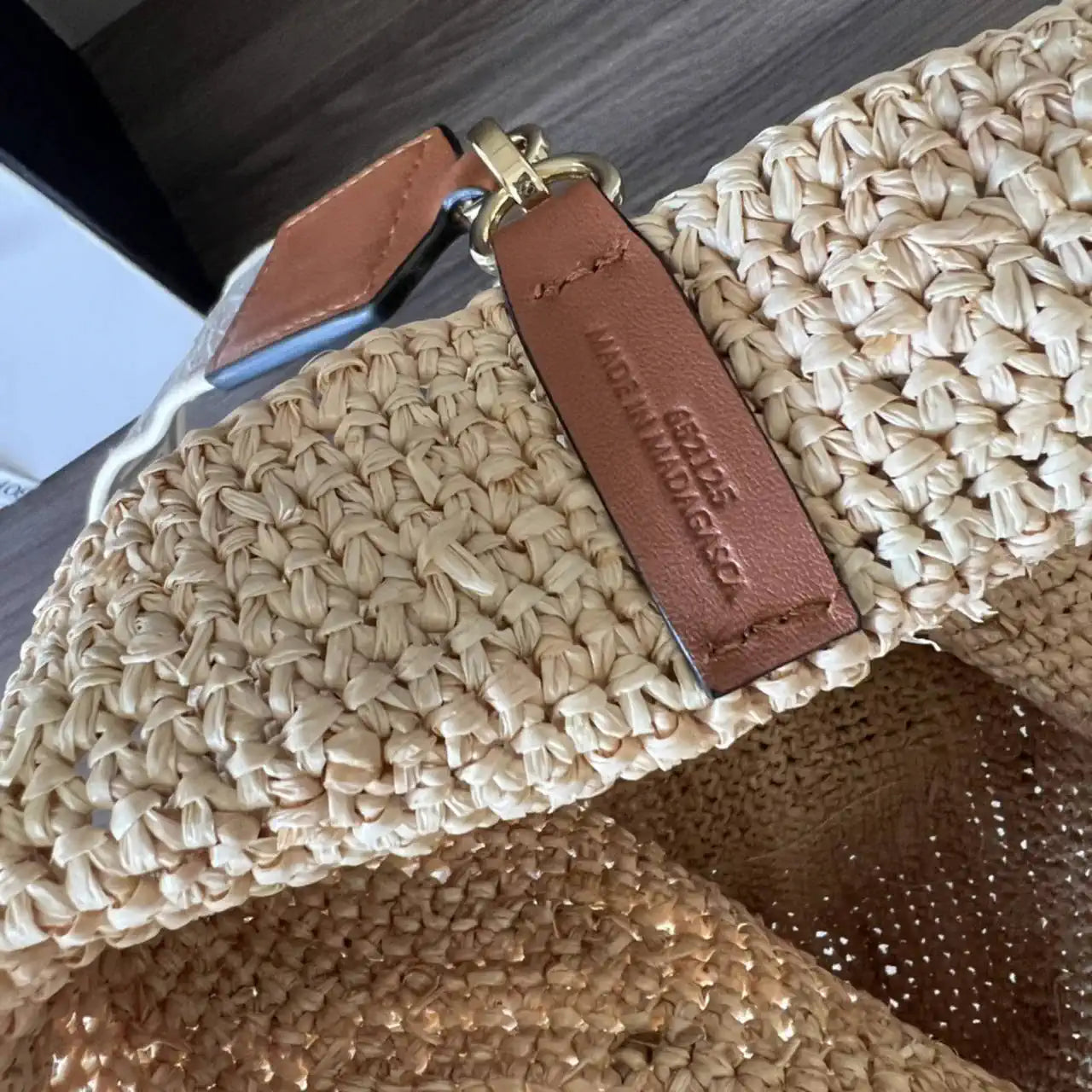 Loewe Slit pochette bag in raffia and calfskin 32824W10