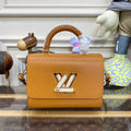 LV M22229 Louis Vuitton Twist MM Handbag Honey Gold - Default Title - View 1
