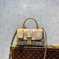 LV M46008 Louis Vuitton Madeleine BB Handbag Monogram Empreinte Leather - Default Title - View 1